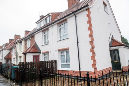 A house with a fence. AI-generated content may be incorrect.